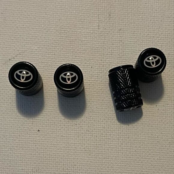 Toyota Logo valve Stem caps in black set of 4 NWT - Picture 1 of 4